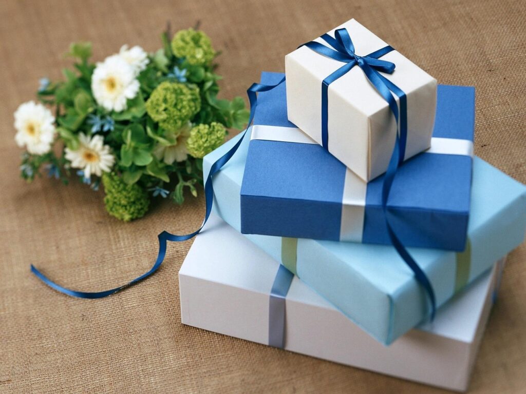 stack of wrapped gifts -self care gift ideas