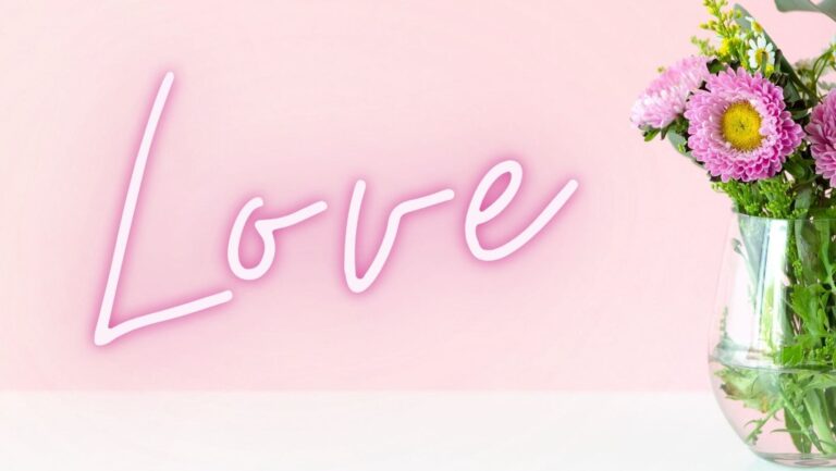 the word love and a vase of flowers - why should I love myself